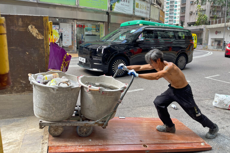 As Hong Kong heats up, calls grow for tougher rules to protect outdoor workers